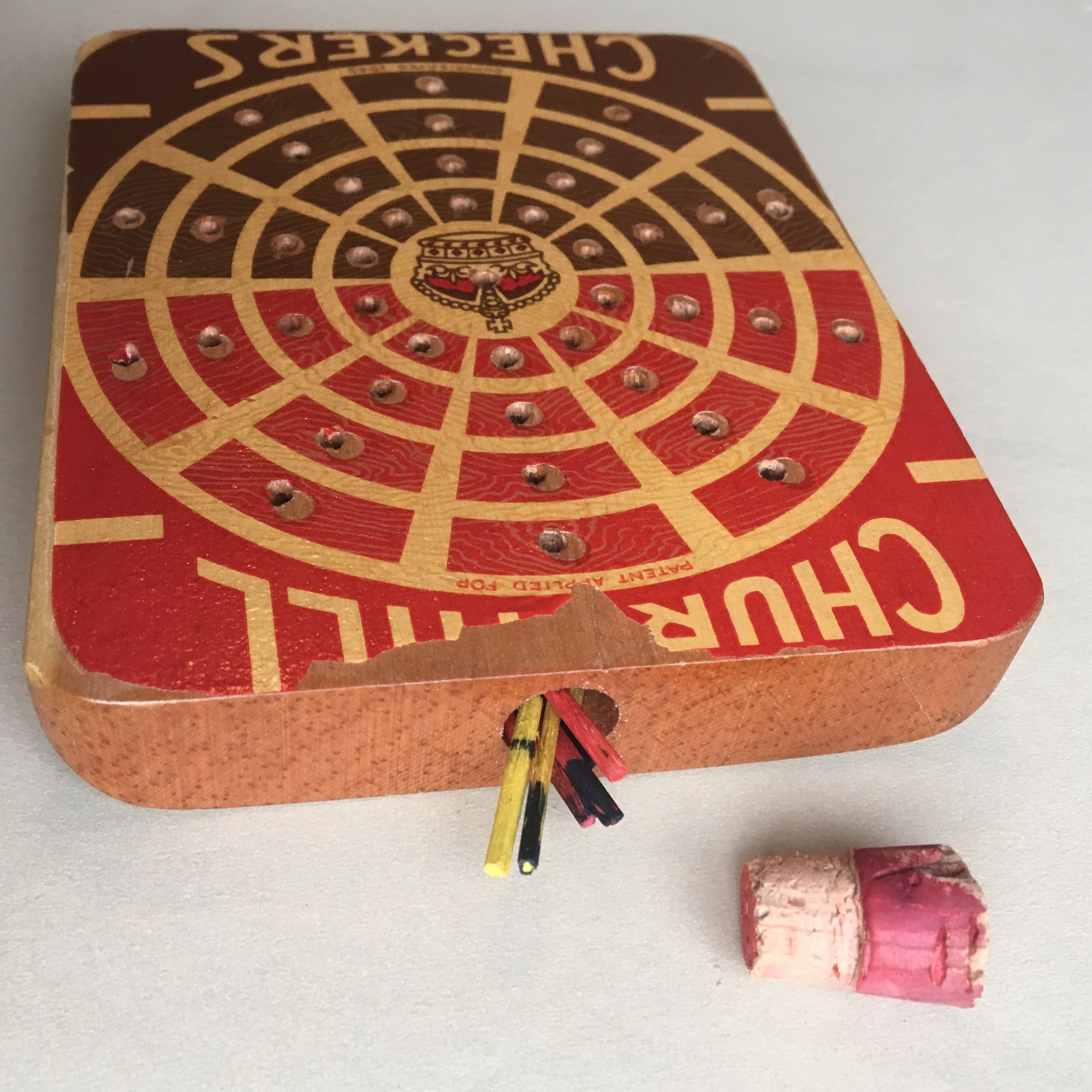 Storage hole and cork in Churchill Checkers wooden block